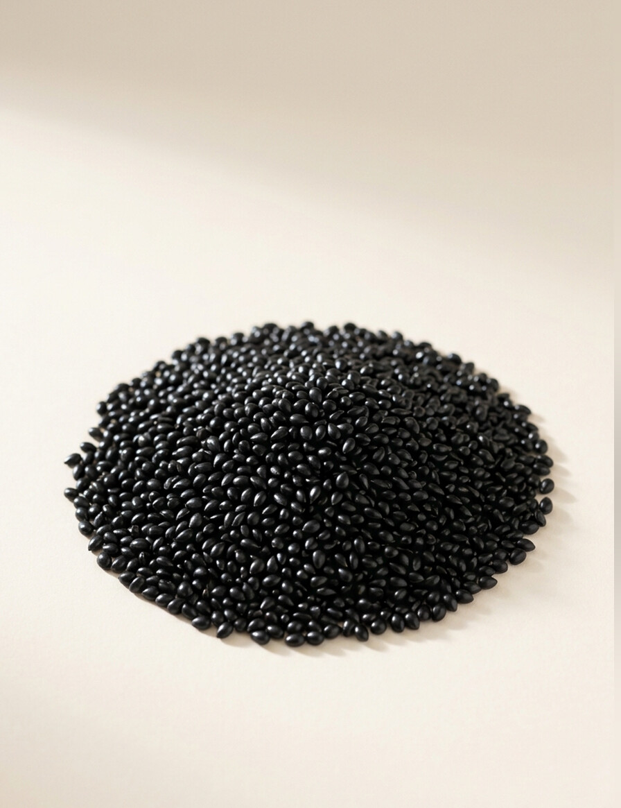 A dense mound of glossy black basil seeds.
