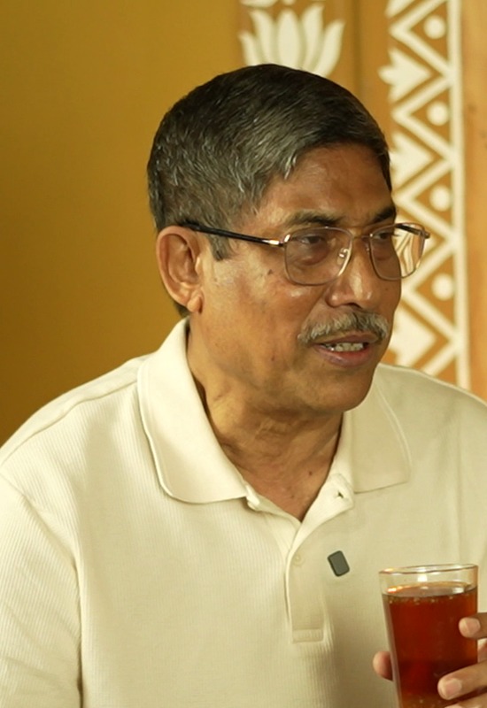 Prof. Mihir Lal Shaha drinking a glass of Chumuk