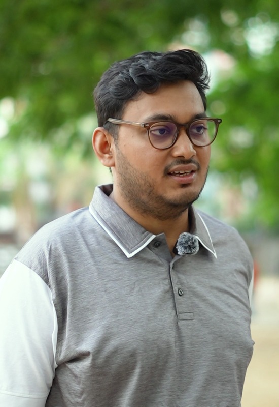 MD Sabbir Ahmed speaking outdoors in a park